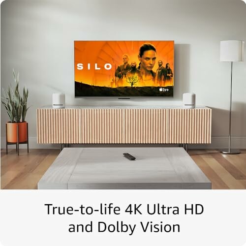Modern living room with 4K Ultra HD TV displaying a show titled 'Silo'.