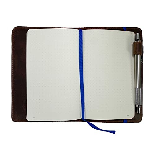 Open notebook with dotted pages and a pen attached.