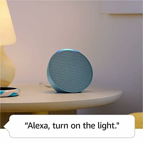 Smart speaker on a table next to a lamp with a command to turn on the light.